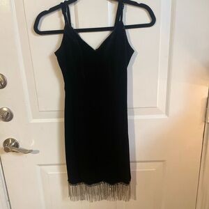 Black dress with diamonds hanging down on the bottom